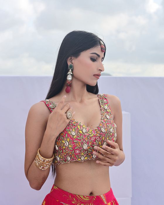 A model showcasing Pink Paisley Print Tiered Lehenga by Foram Patel from Foram Patel's collection