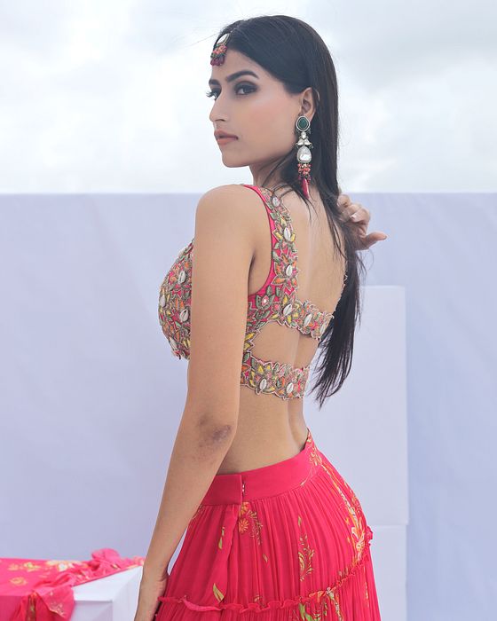 A model showcasing Pink Paisley Print Tiered Lehenga by Foram Patel from Foram Patel's collection