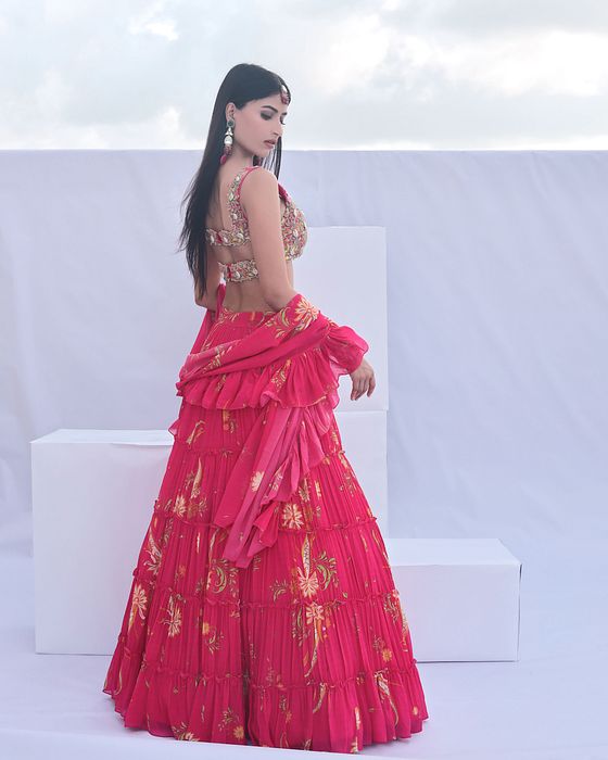 A model showcasing Pink Paisley Print Tiered Lehenga by Foram Patel from Foram Patel's collection