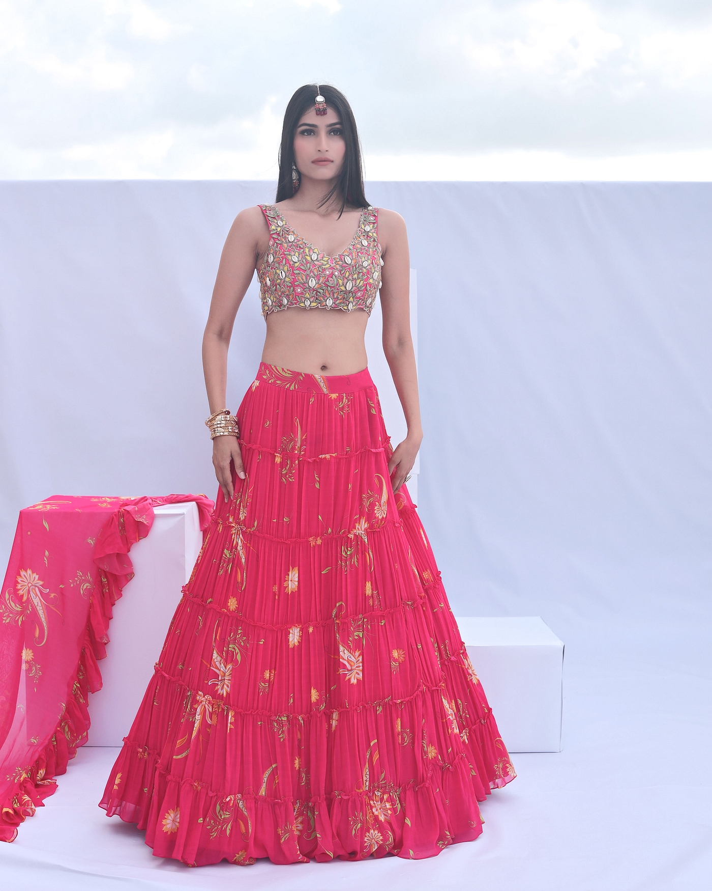 A model showcasing Pink Paisley Print Tiered Lehenga Feature image by Foram Patel from Foram Patel's collection