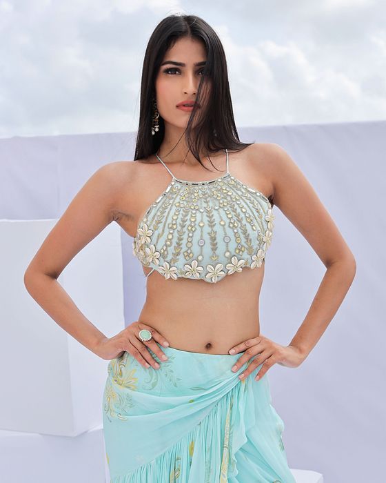 A model showcasing Blue Predraped Ruffle Paisely Print Saree Set by Foram Patel from Foram Patel's collection