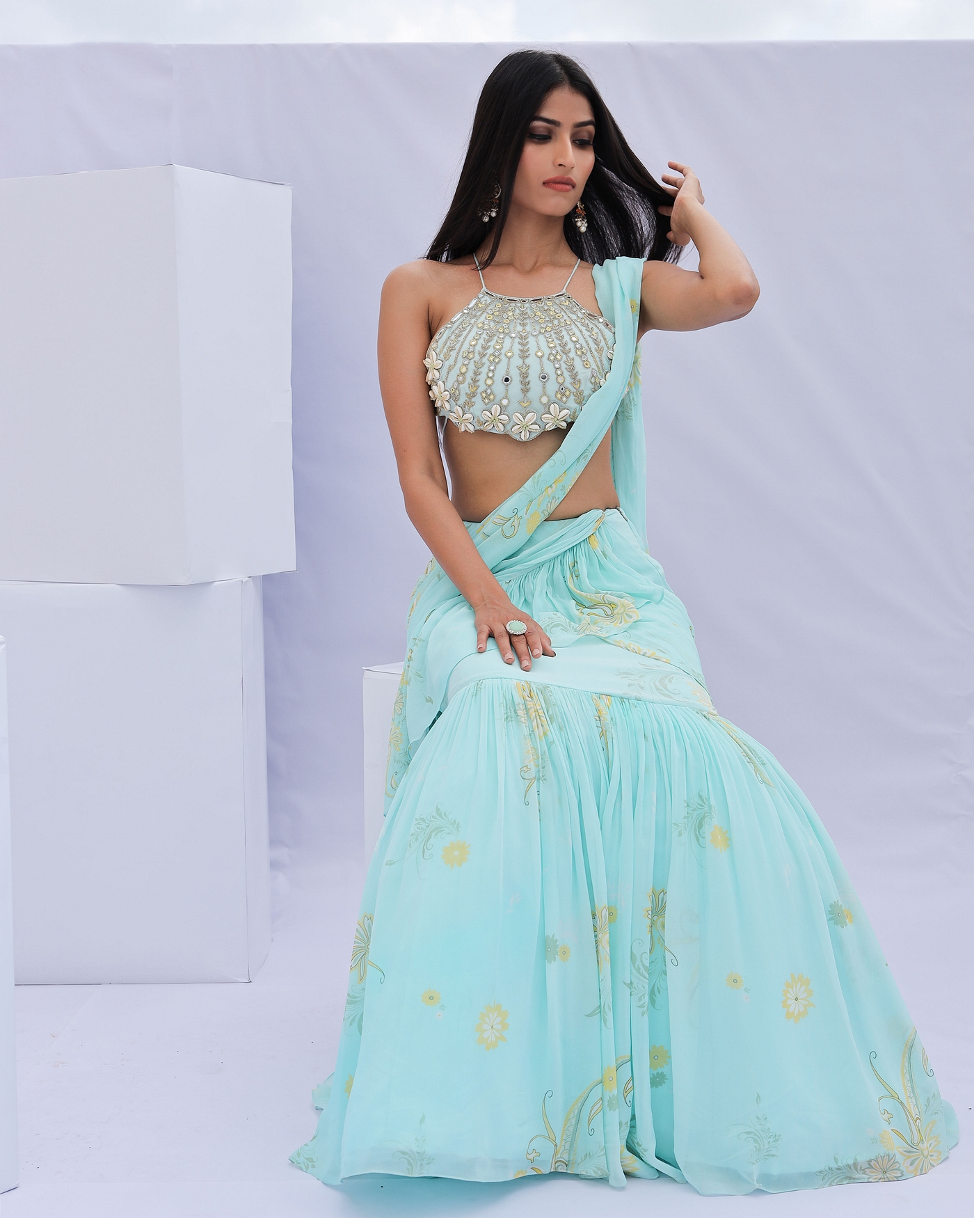 A model showcasing Blue Predraped Ruffle Paisely Print Saree Set Feature image by Foram Patel from Foram Patel's collection