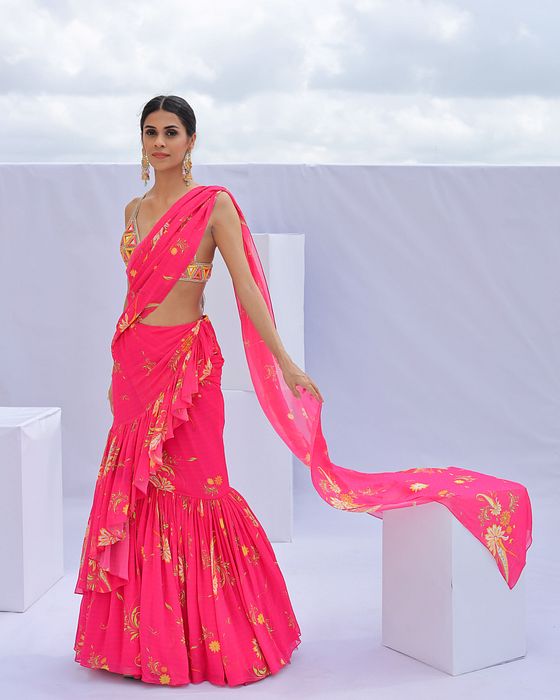 A model showcasing Pink Predraped Ruffle Paisley Print Saree Set by Foram Patel from Foram Patel's collection