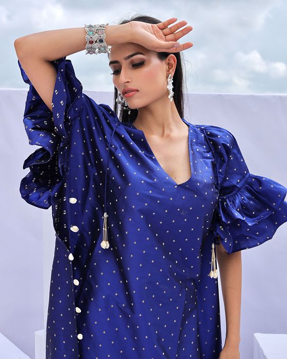 A model showcasing Electric Blue Brocade Kaftan by Foram Patel from Foram Patel's collection