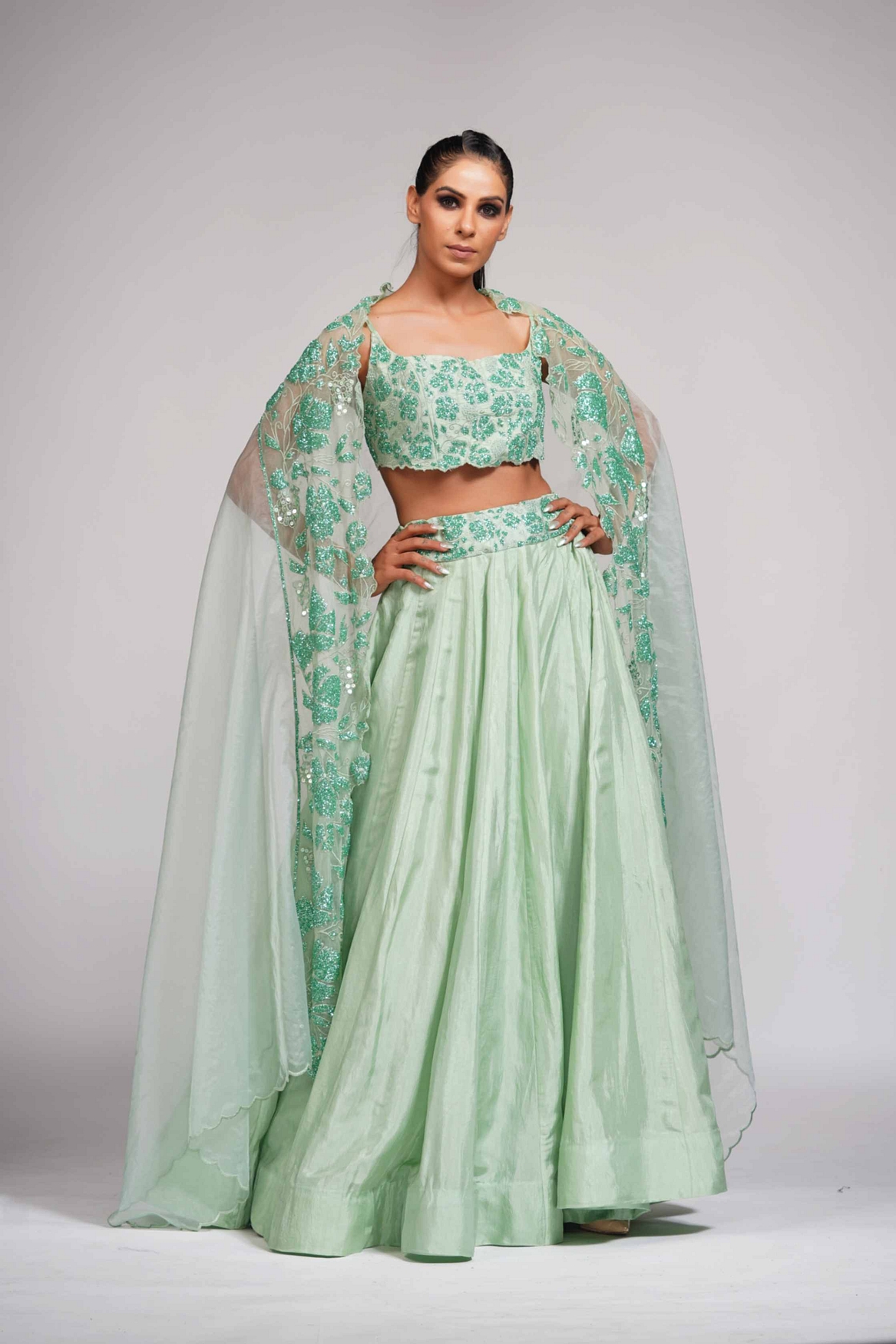 A model showcasing Green Grapewine Cutwork Blouse N Dupatta With Silk Lehenga Feature image by Shruti S Label from Shruti S Label's collection