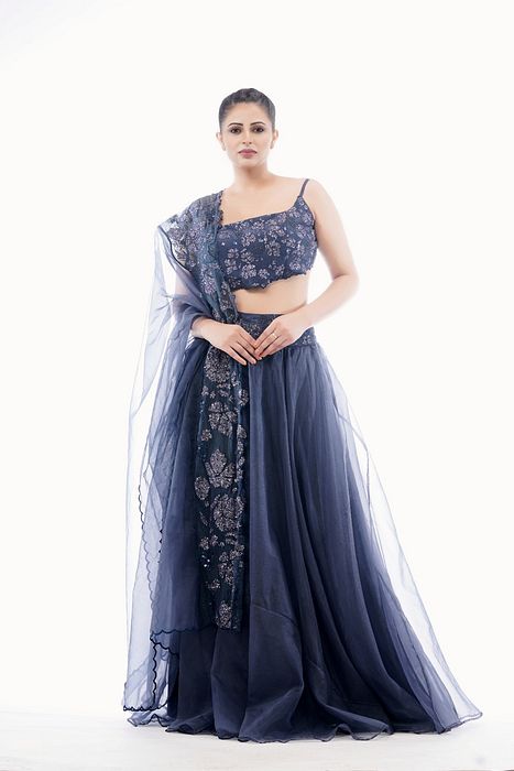 A model showcasing Grey Grapewine Cutwork Blouse N Dupatta With Organza Lehenga by Shruti S Label from Shruti S Label's collection