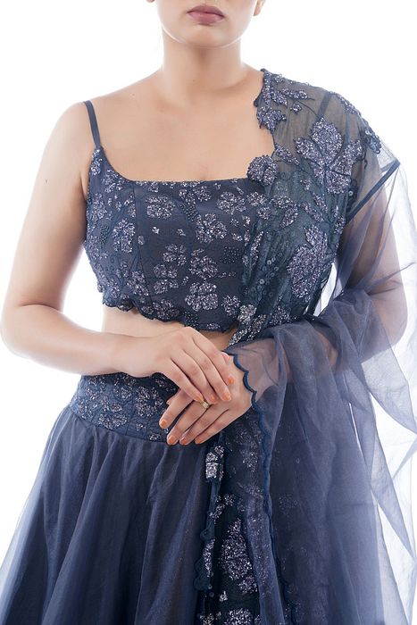 A model showcasing Grey Grapewine Cutwork Blouse N Dupatta With Organza Lehenga by Shruti S Label from Shruti S Label's collection
