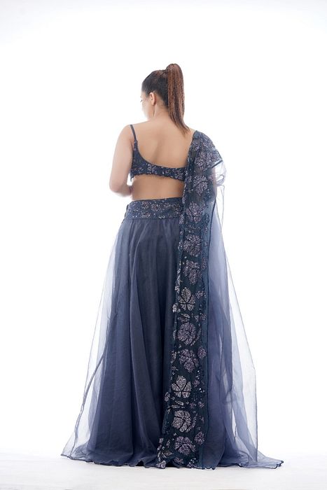 A model showcasing Grey Grapewine Cutwork Blouse N Dupatta With Organza Lehenga by Shruti S Label from Shruti S Label's collection