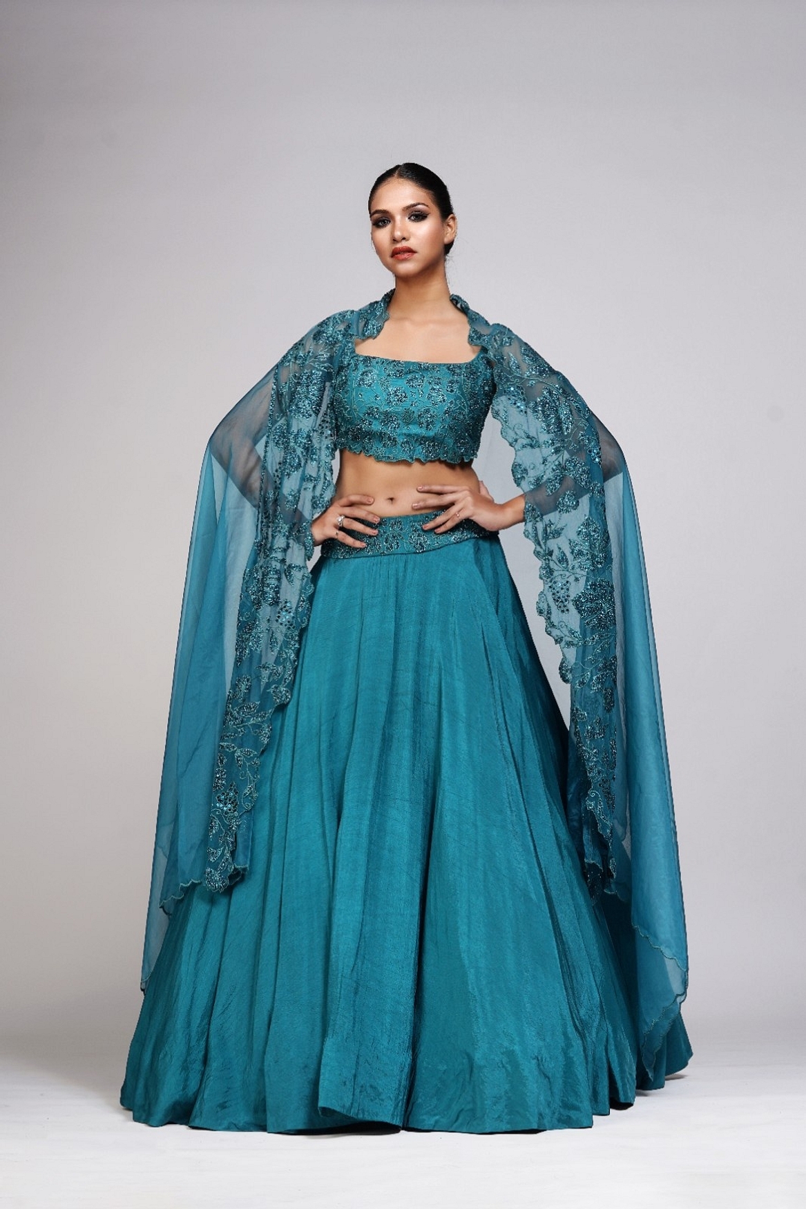 A model showcasing Grapevine Teal Silk Lehenga Feature image by Shruti S Label from Shruti S Label's collection
