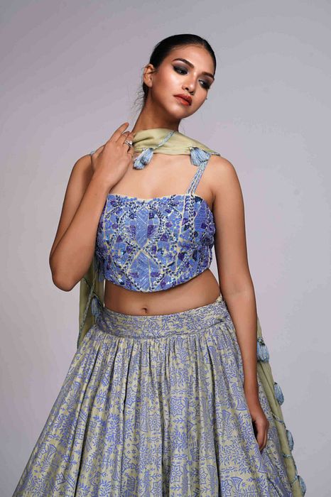 A model showcasing Green Bohemian Handpainted Lehenga by Shruti S Label from Shruti S Label's collection