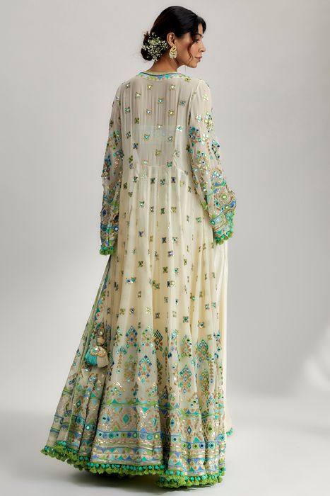 A model showcasing Ridham Jacket Set With Victorian Skirt In Ivory by Gopi Vaid from Gopi Vaid's collection