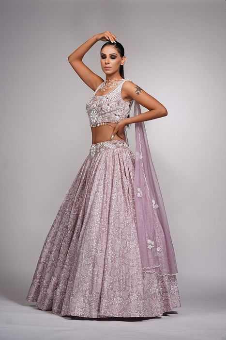 A model showcasing Lilac Lehenga With Offwhite Hand Paint Pearl Embroidery by Shruti S Label from Shruti S Label's collection