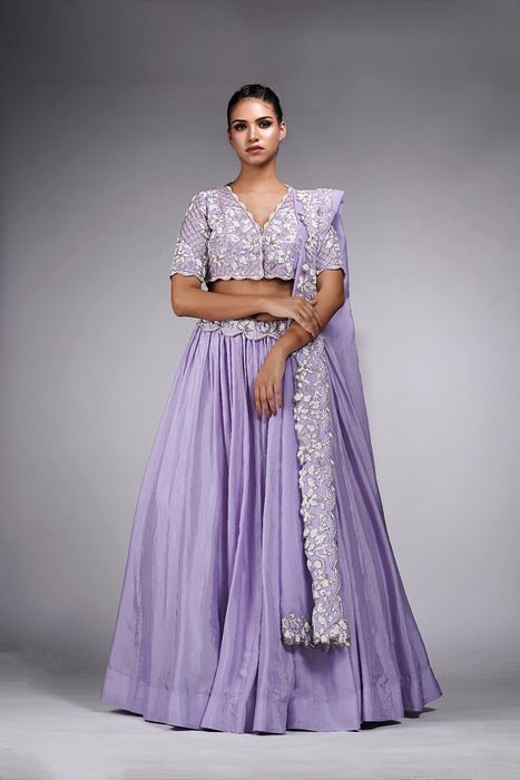 A model showcasing Lavender Lehenga With White Embroidery by Shruti S Label from Shruti S Label's collection