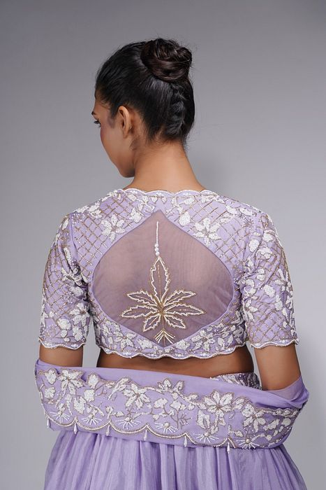 A model showcasing Lavender Lehenga With White Embroidery by Shruti S Label from Shruti S Label's collection