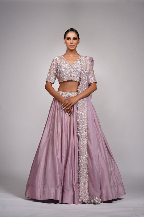 A model showcasing Lilac Lehenga With White Embroidery by Shruti S Label from Shruti S Label's collection