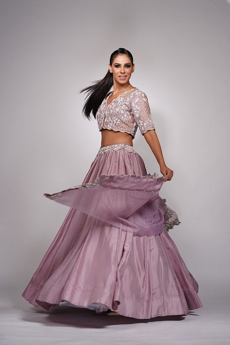 A model showcasing Lilac Lehenga With White Embroidery by Shruti S Label from Shruti S Label's collection