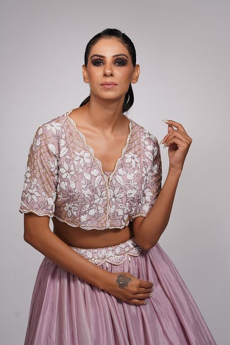 A model showcasing Lilac Lehenga With White Embroidery by Shruti S Label from Shruti S Label's collection