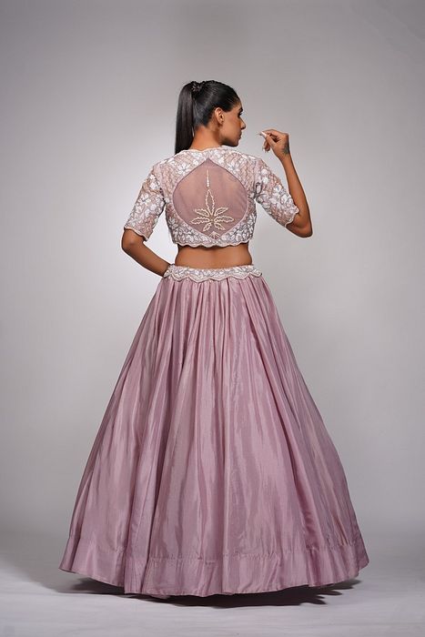 A model showcasing Lilac Lehenga With White Embroidery by Shruti S Label from Shruti S Label's collection