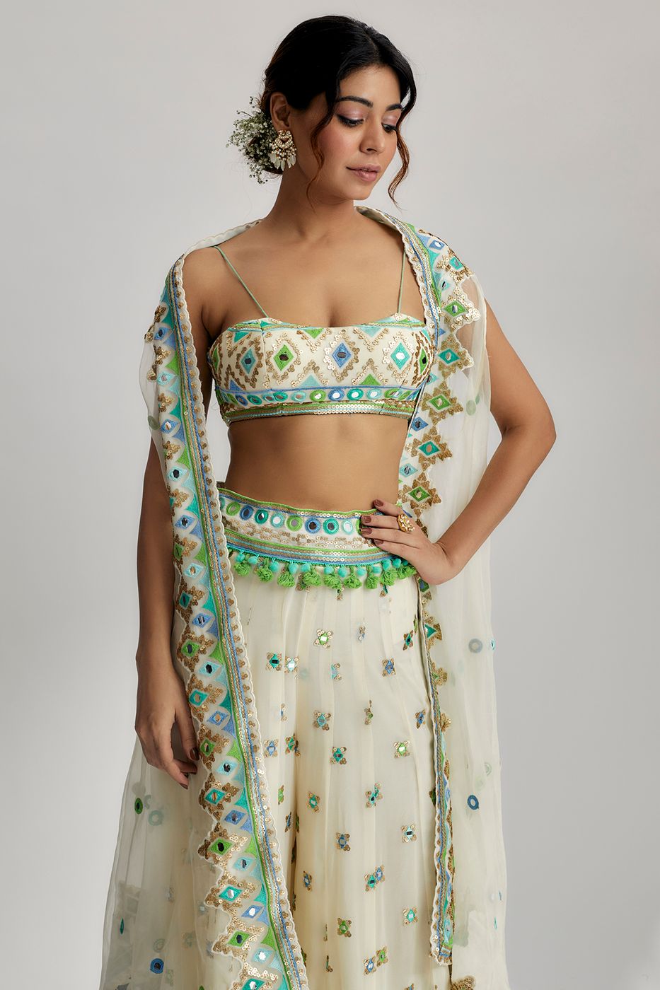 A model showcasing The Imrat Cape Set With Skirt In Ivory Feature image by Gopi Vaid from Gopi Vaid's collection