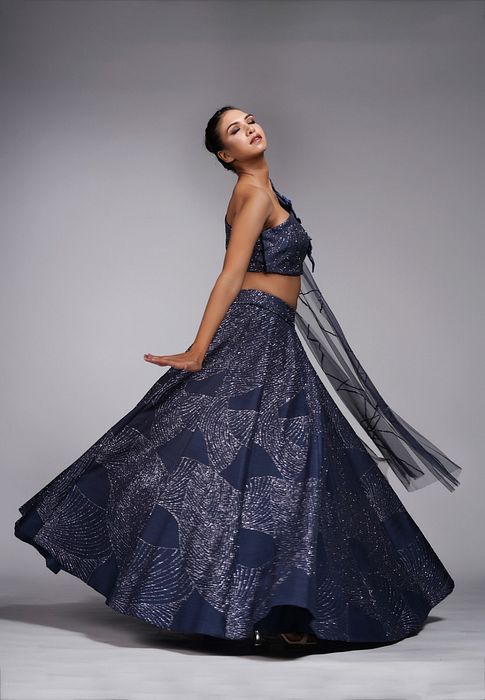 A model showcasing Leaves Blue Lehenga Gown by Shruti S Label from Shruti S Label's collection