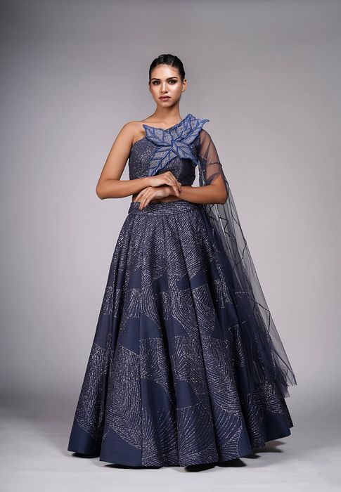 A model showcasing Leaves Blue Lehenga Gown by Shruti S Label from Shruti S Label's collection