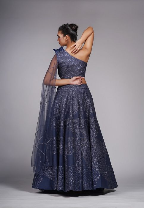 A model showcasing Leaves Blue Lehenga Gown by Shruti S Label from Shruti S Label's collection