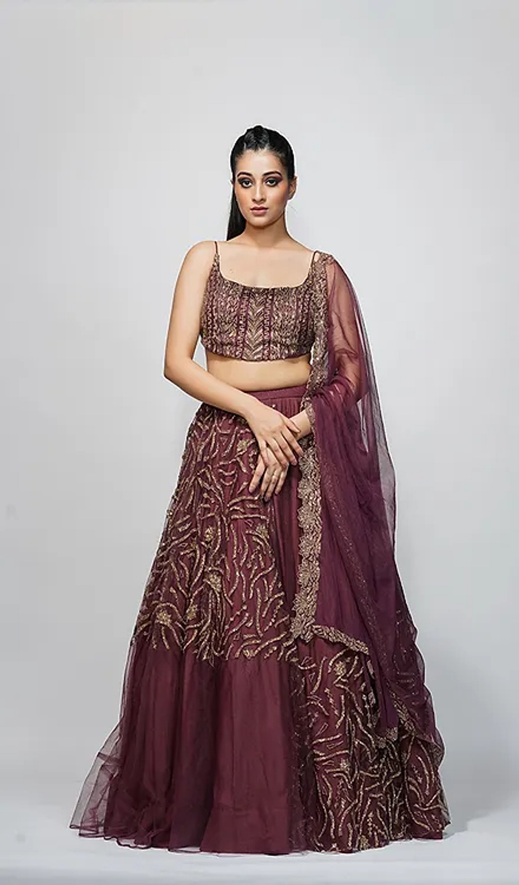 A model showcasing Tavus Wine Gold Half Half Lehenga Feature image by Shruti S Label from Shruti S Label's collection