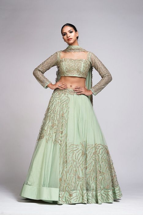 A model showcasing Pastel Green Zari Lehenga by Shruti S Label from Shruti S Label's collection