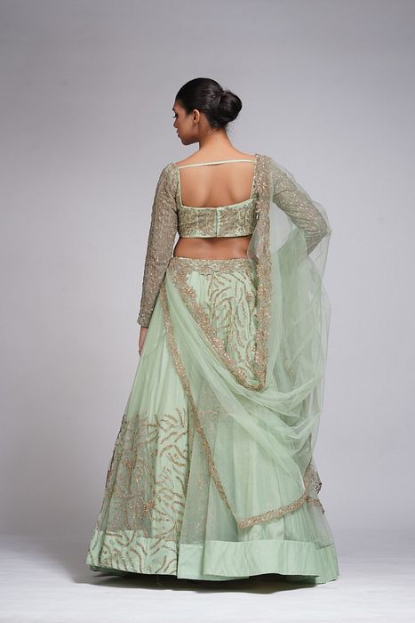A model showcasing Pastel Green Zari Lehenga by Shruti S Label from Shruti S Label's collection