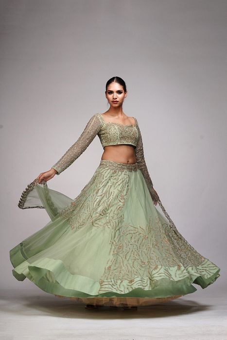 A model showcasing Pastel Green Zari Lehenga by Shruti S Label from Shruti S Label's collection