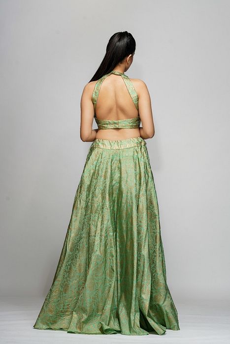 A model showcasing Metallic Hand Block Print Lehenga Sage Green by Shruti S Label from Shruti S Label's collection