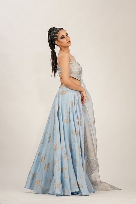 A model showcasing Ice Blue Umbrella Print Lehenga by Shruti S Label from Shruti S Label's collection