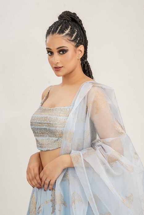 A model showcasing Ice Blue Umbrella Print Lehenga by Shruti S Label from Shruti S Label's collection