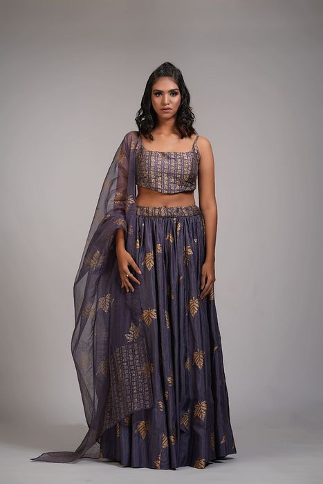 A model showcasing Falling Leaves Hand Block Printed Lehenga Set In Silk by Shruti S Label from Shruti S Label's collection