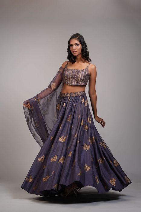 A model showcasing Falling Leaves Hand Block Printed Lehenga Set In Silk by Shruti S Label from Shruti S Label's collection
