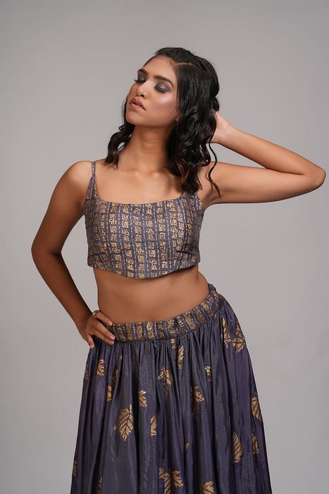 A model showcasing Falling Leaves Hand Block Printed Lehenga Set In Silk by Shruti S Label from Shruti S Label's collection