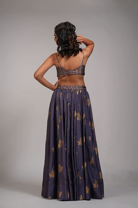 A model showcasing Falling Leaves Hand Block Printed Lehenga Set In Silk by Shruti S Label from Shruti S Label's collection
