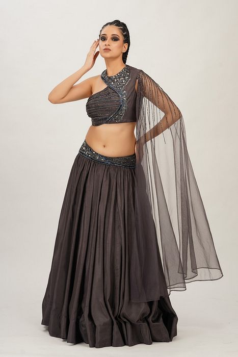 A model showcasing Lead Grey Cross Body Bustier Lehenga by Shruti S Label from Shruti S Label's collection