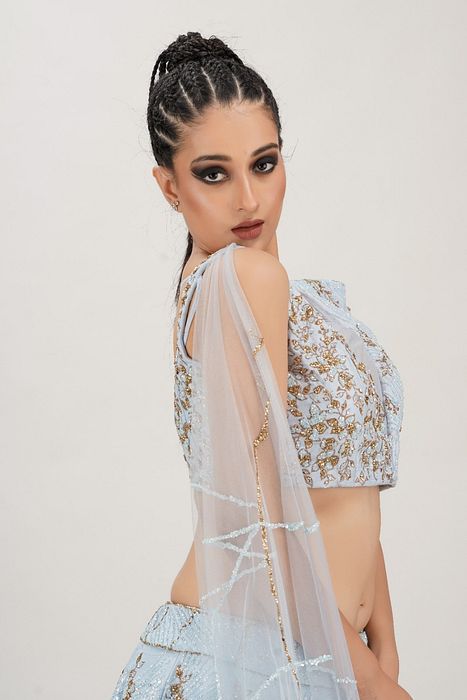 A model showcasing Powder Blue Constructed Bustier Lehenga by Shruti S Label from Shruti S Label's collection