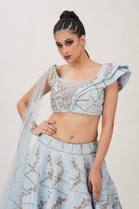A model showcasing Powder Blue Constructed Bustier Lehenga by Shruti S Label from Shruti S Label's collection