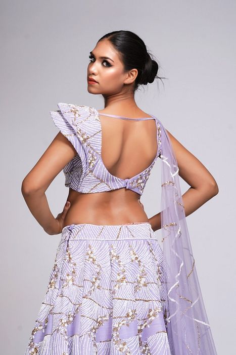 A model showcasing Lavender Lehenga With Shruti S Collar by Shruti S Label from Shruti S Label's collection