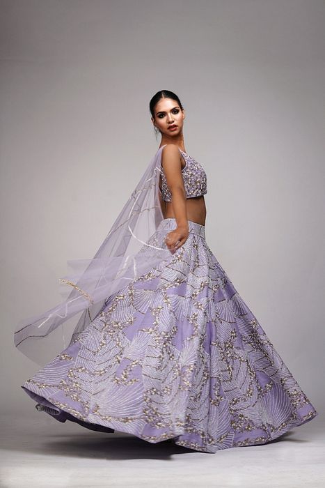 A model showcasing Lavender Lehenga With Shruti S Collar by Shruti S Label from Shruti S Label's collection