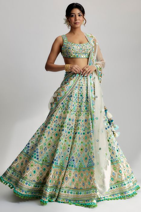 A model showcasing Ivory Avantika Lehenga by Gopi Vaid from Gopi Vaid's collection