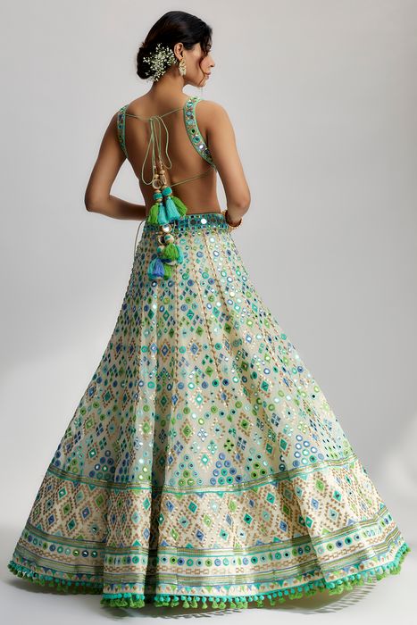 A model showcasing Ivory Avantika Lehenga by Gopi Vaid from Gopi Vaid's collection