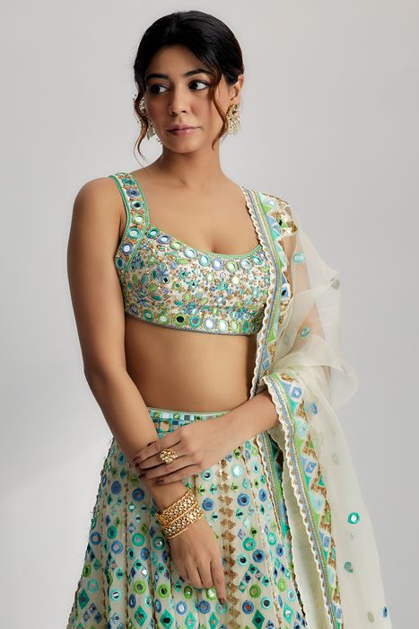 A model showcasing Ivory Avantika Lehenga by Gopi Vaid from Gopi Vaid's collection