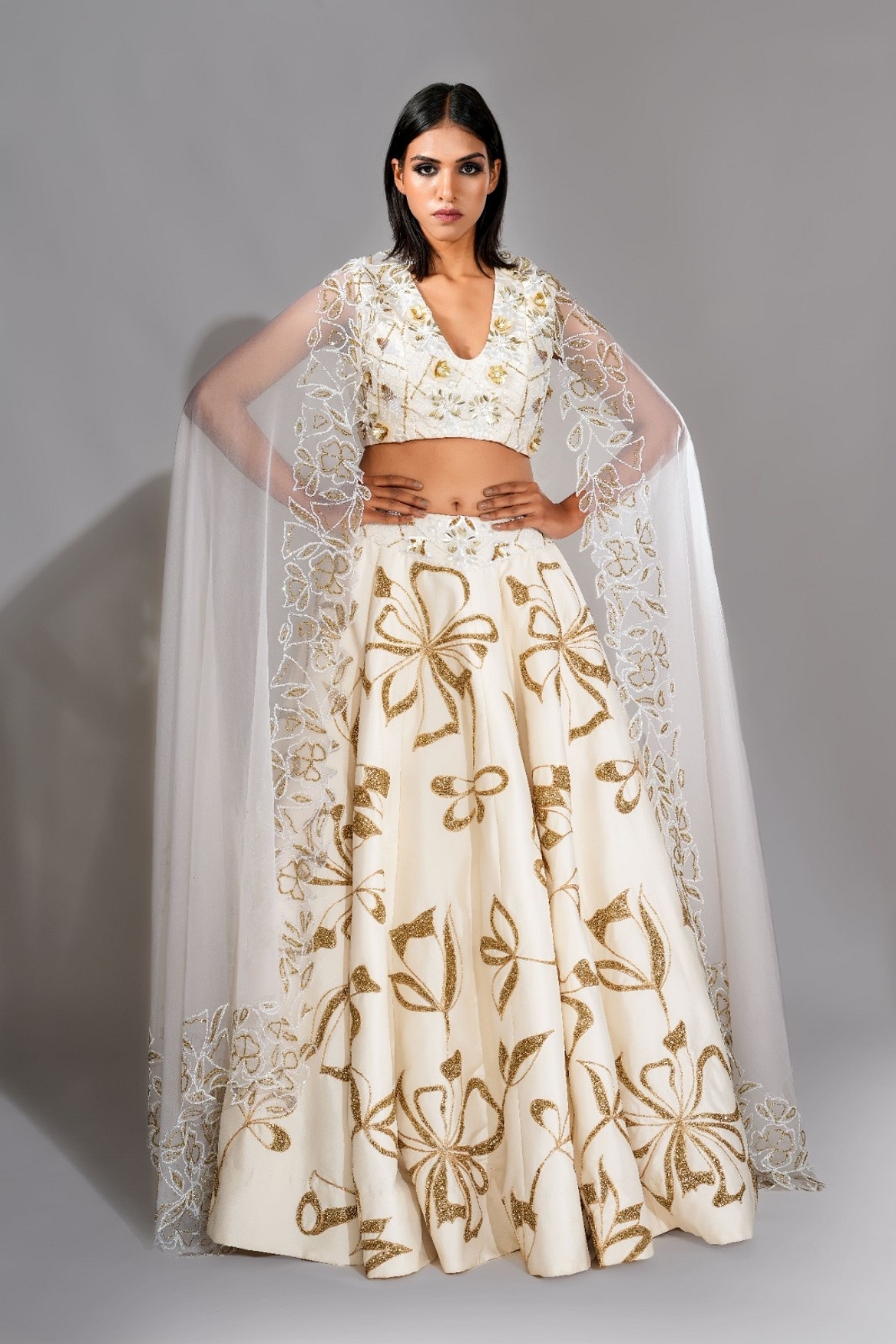 A model showcasing Offwhite And Gold Lehenga With Sequins Work Feature image by Shruti S Label from Shruti S Label's collection