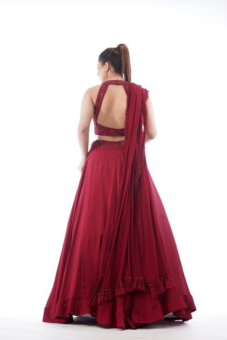 A model showcasing Halter Neck Blouse With Asymmetrical Circular Skirt by Shruti S Label from Shruti S Label's collection