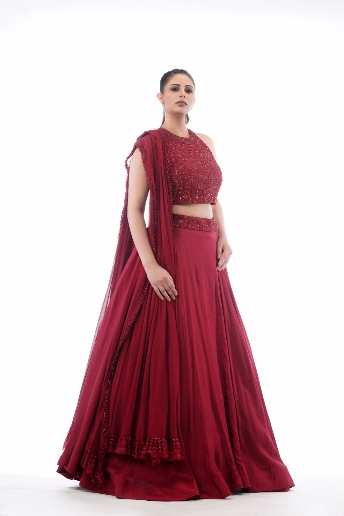 A model showcasing Halter Neck Blouse With Asymmetrical Circular Skirt Feature image by Shruti S Label from Shruti S Label's collection