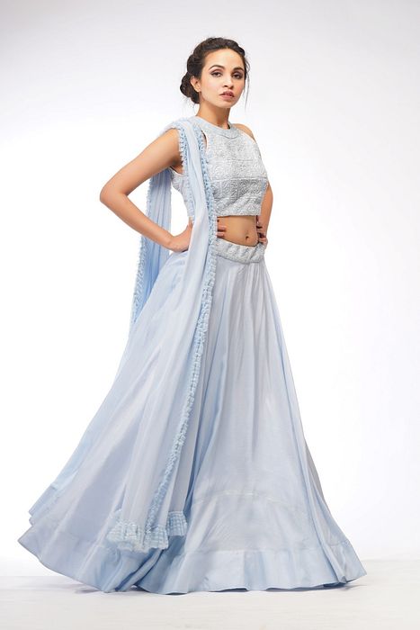 A model showcasing Halter Neck Blouse With Asymmetrical Ice Blue Skirt by Shruti S Label from Shruti S Label's collection