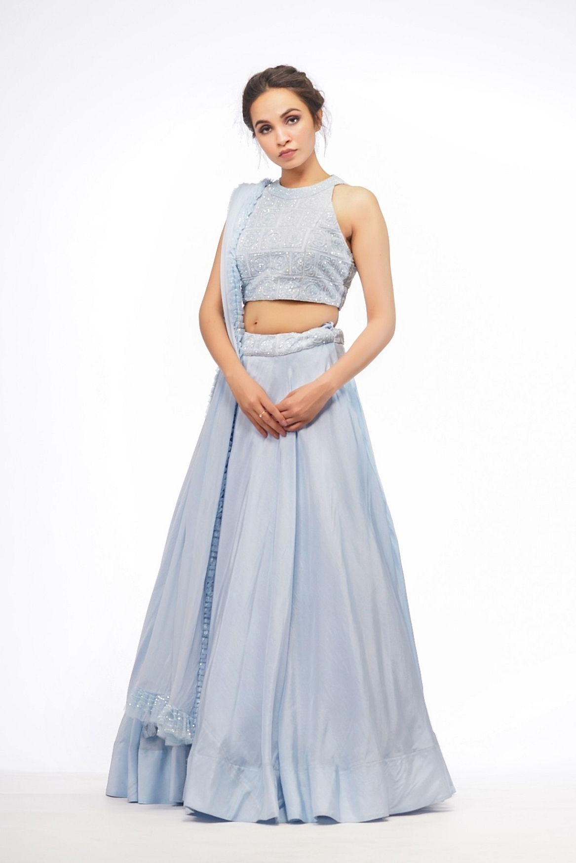 A model showcasing Halter Neck Blouse With Asymmetrical Ice Blue Skirt Feature image by Shruti S Label from Shruti S Label's collection